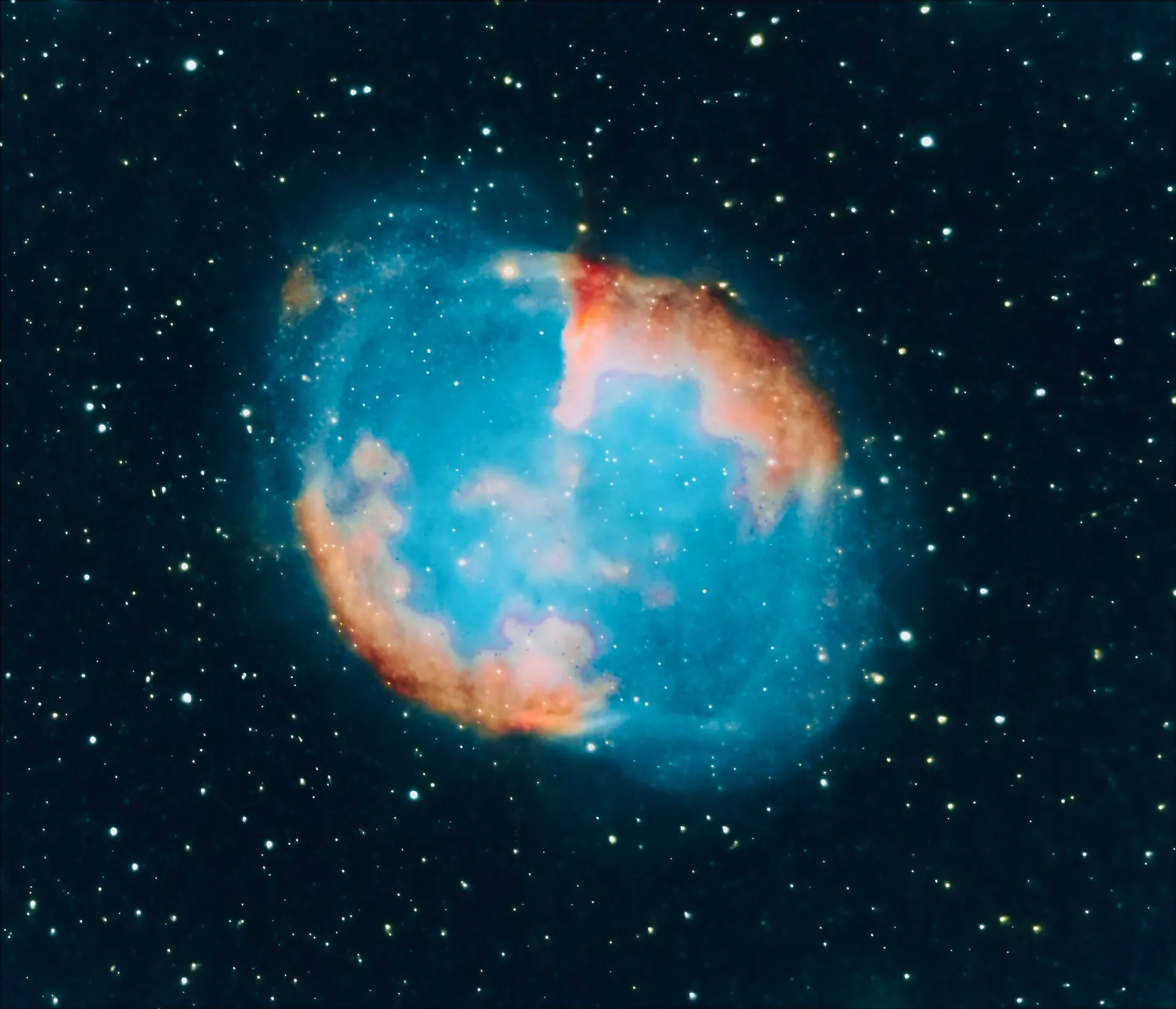 Blue and red nebula surrounded by stars